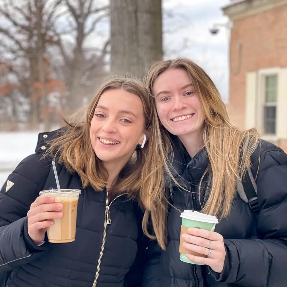 Students keeping warm on campus with their favorite drinks